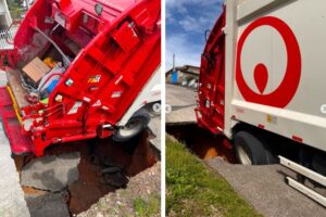 Cratera se abre e “engole” roda de caminhão de lixo em Brusque